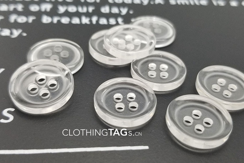 Transparent polyester buttons
