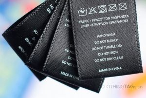 Printed black satin fabric care label with size  | center fold 706